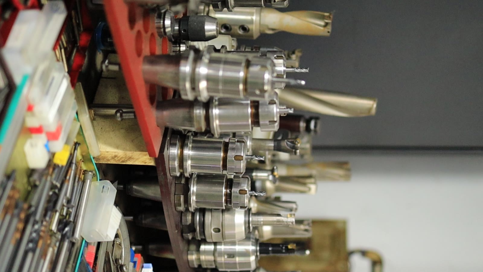 CNC milling tool holders and cutting bits on a rack at RUUIPON Dongguan production base