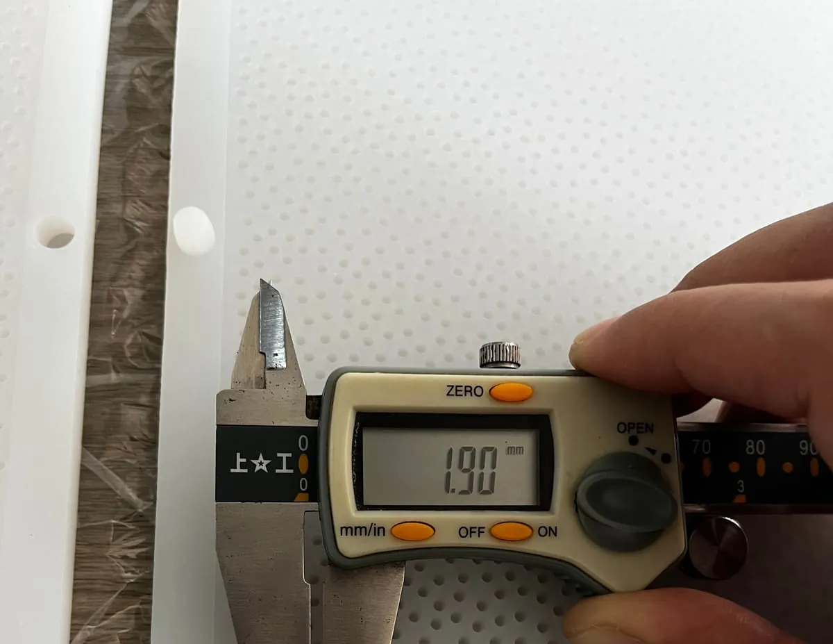 Digital caliper reading 1.90 mm on a tray pin