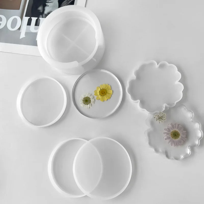 White silicone coaster molds with flower-inclusion resin castings
